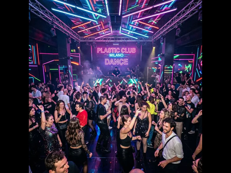 Plastic club Milan interior with colourful lighting and packed dance floor