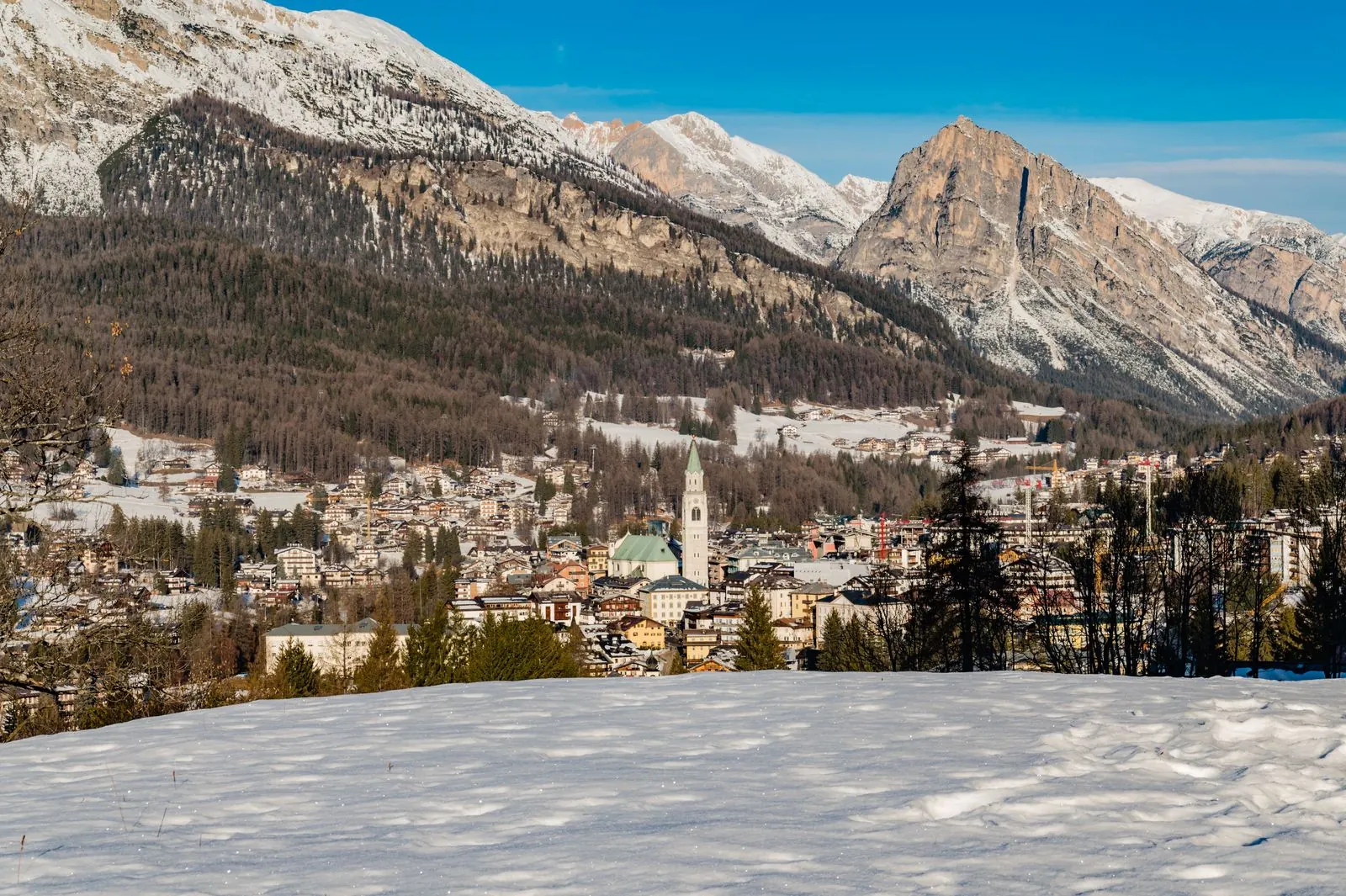 Cortina d'Ampezzo under snow, with the Dolomites behind