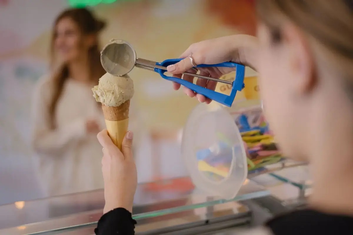 Gelato being scooped into a cone