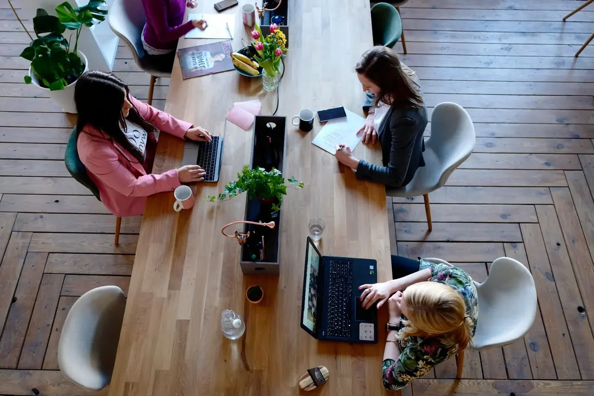 People working at a shared coworking table