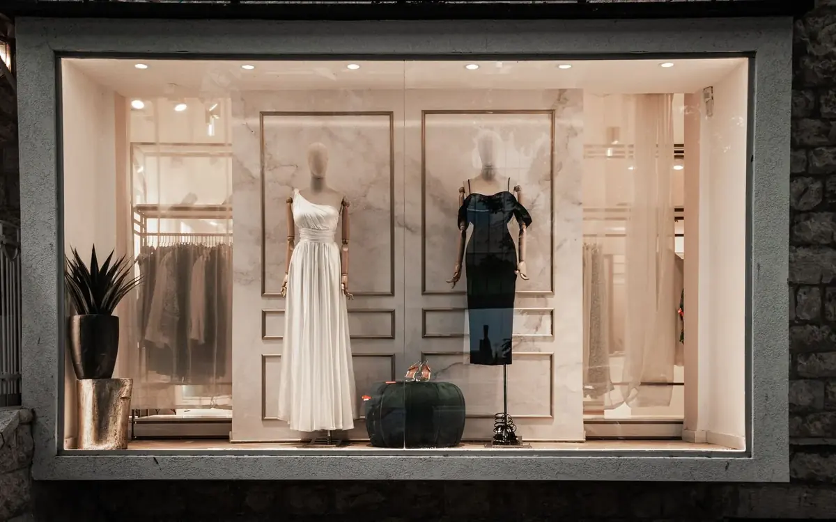Dresses on mannequins in a boutique window