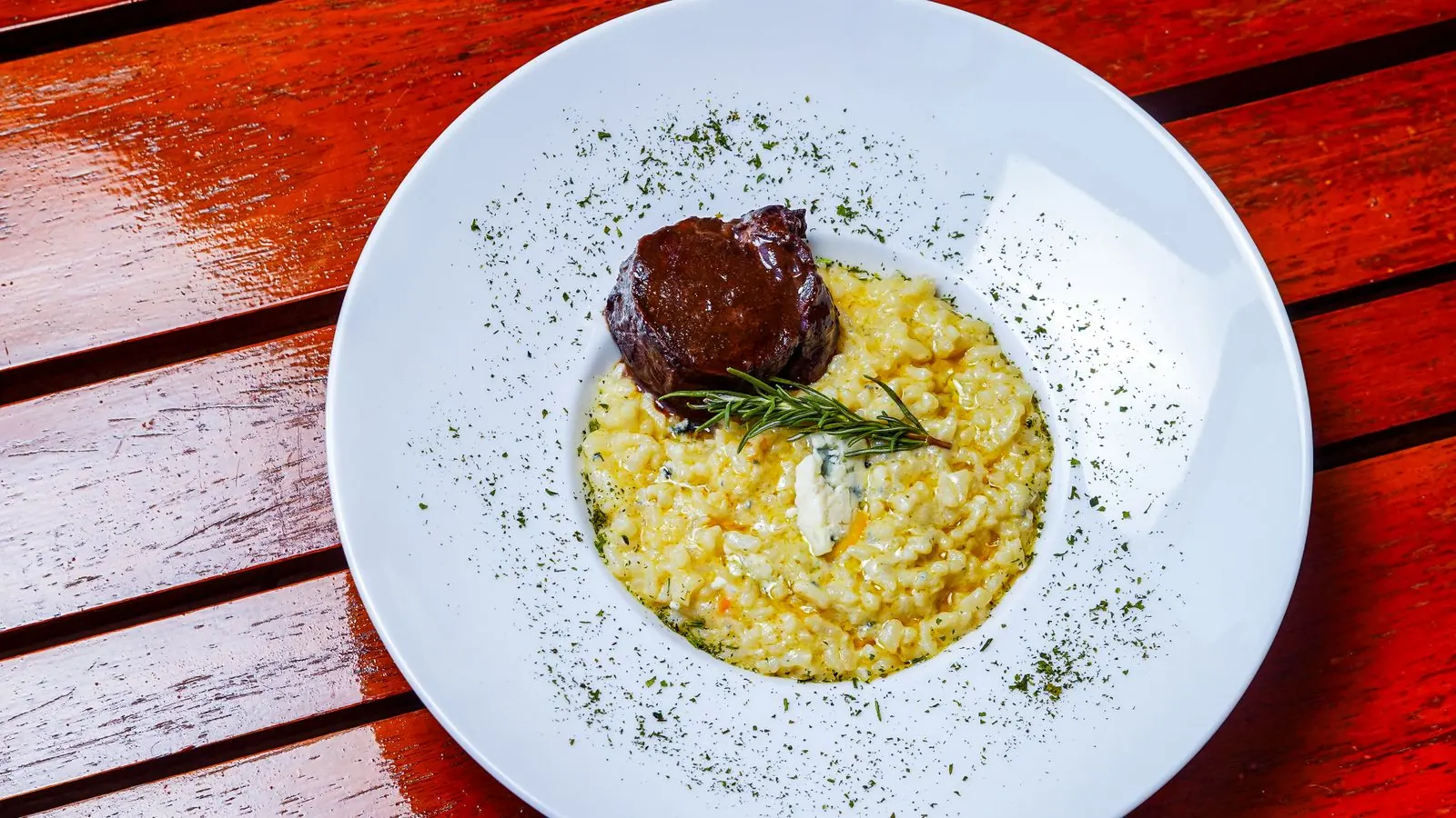 Saffron risotto served with braised meat