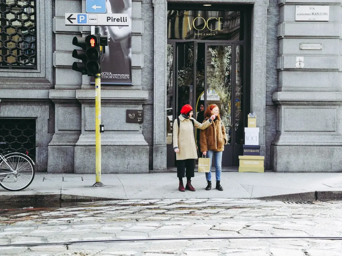 Shoppers outside a store in central Milan