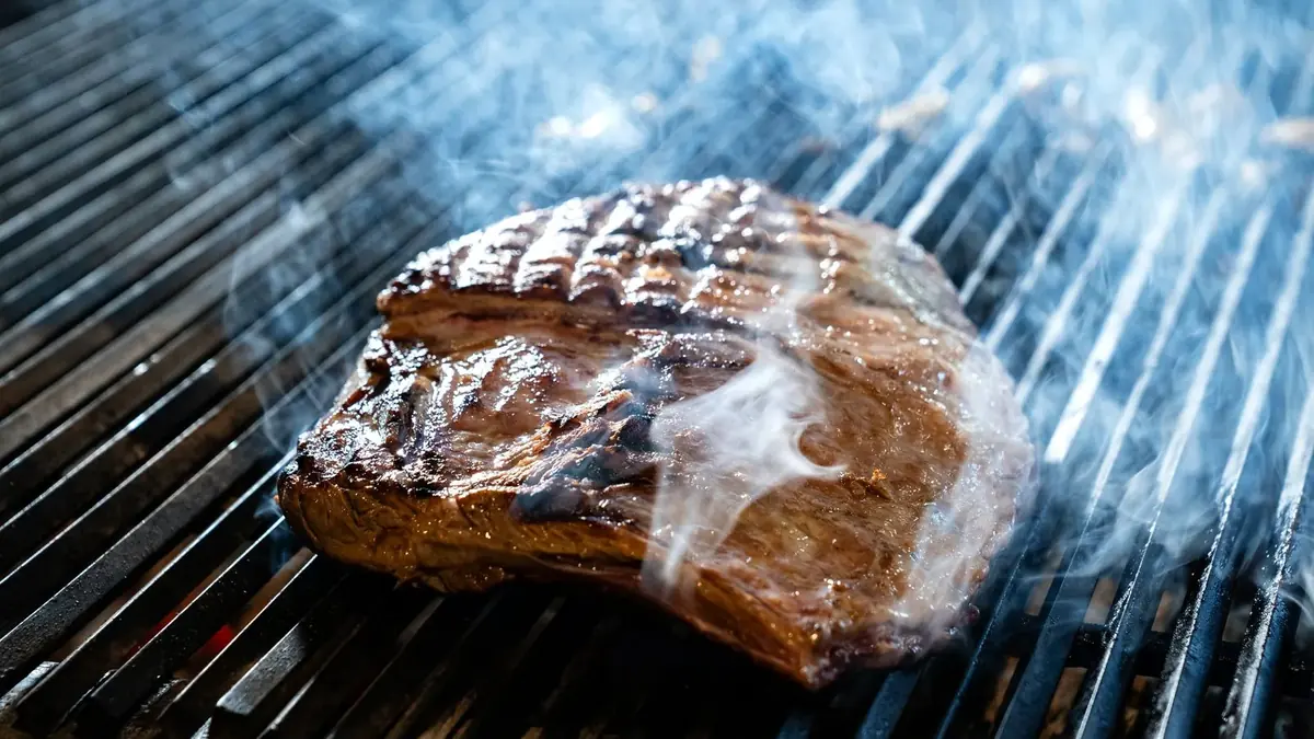 Steak on a smoking grill