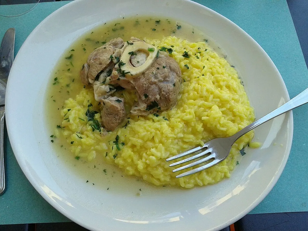 Risotto alla milanese served with ossobuco